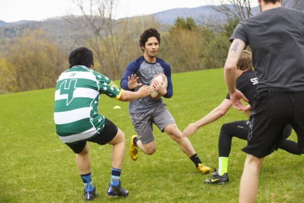 A group of young men playing rugby.