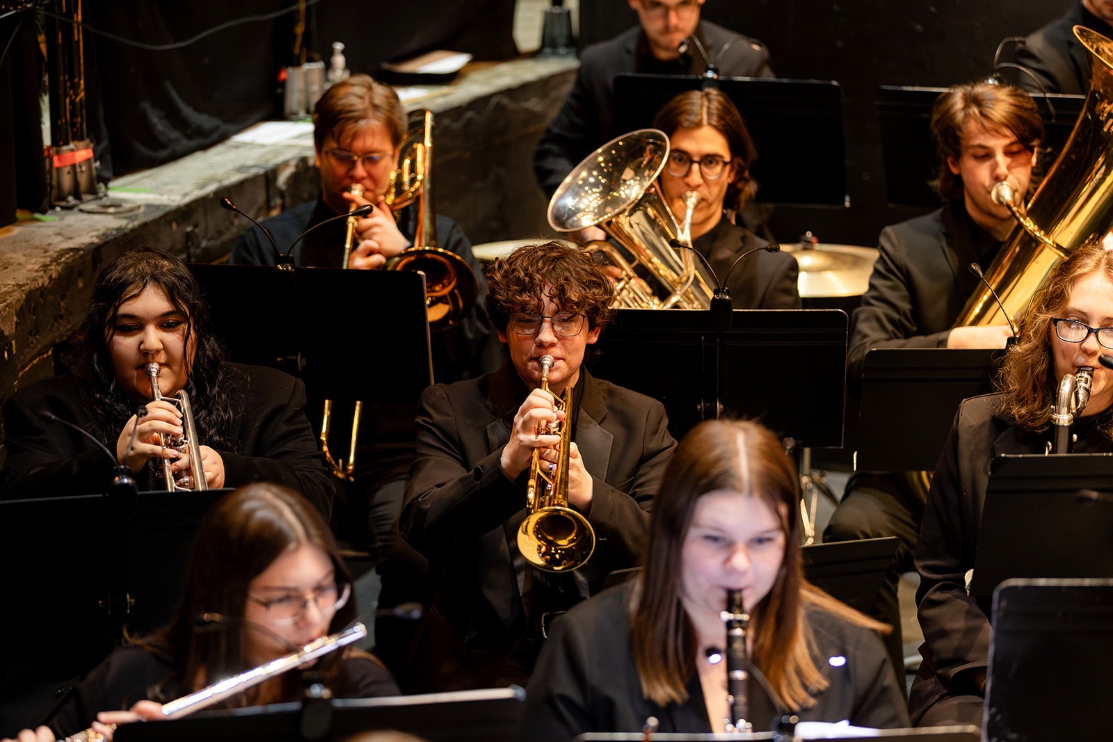 Several students in the brass section performing with the VTSU Wind Ensemble