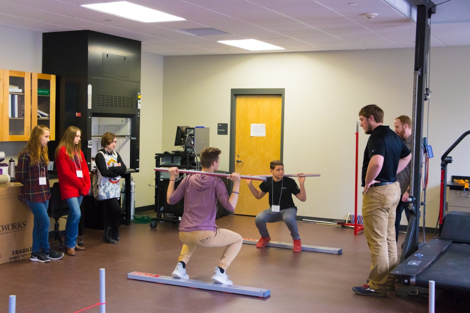 A group of people exercising in a room at Vermont State University.