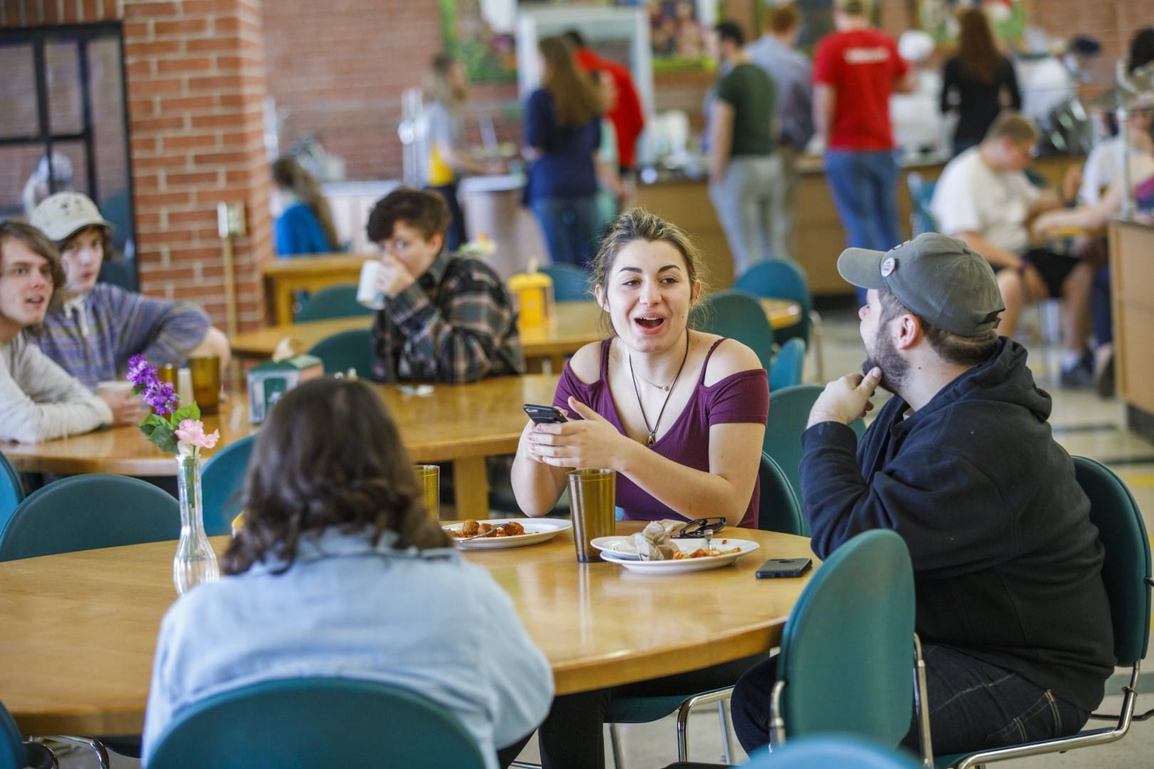 A group of students in a dining hall on the Vermont State University Lyndon campus.