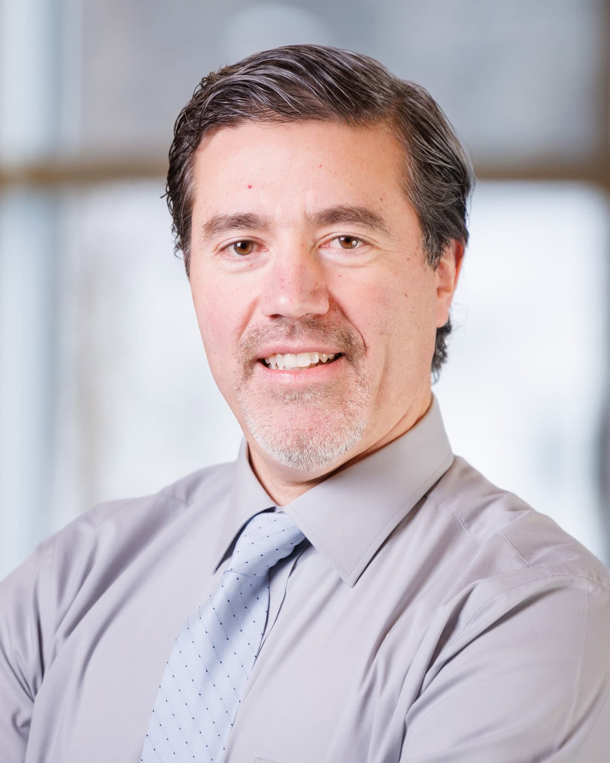 Andre Fleche smiling at the camera