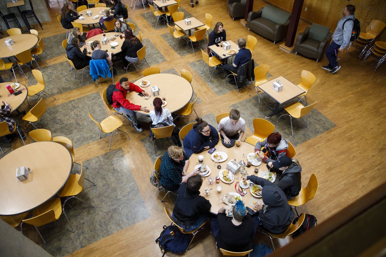 A downward view of the Vermont State University Johnson dining hall as students eat.