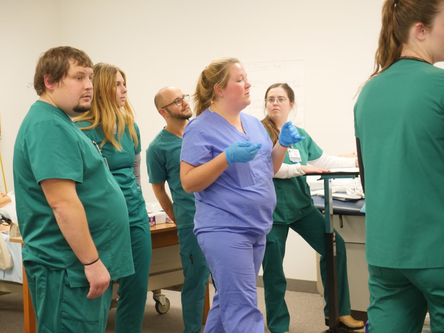A woman talks to a class of Vermont State University nursing students.