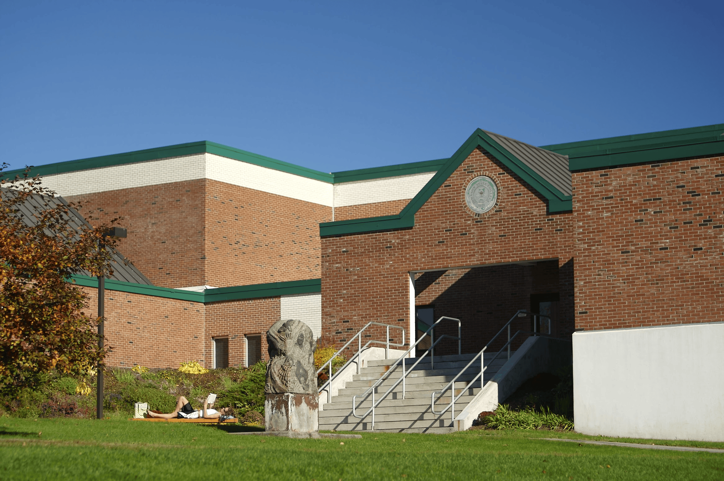 A brick building with a green roof on the Vermont State Johnson campus.