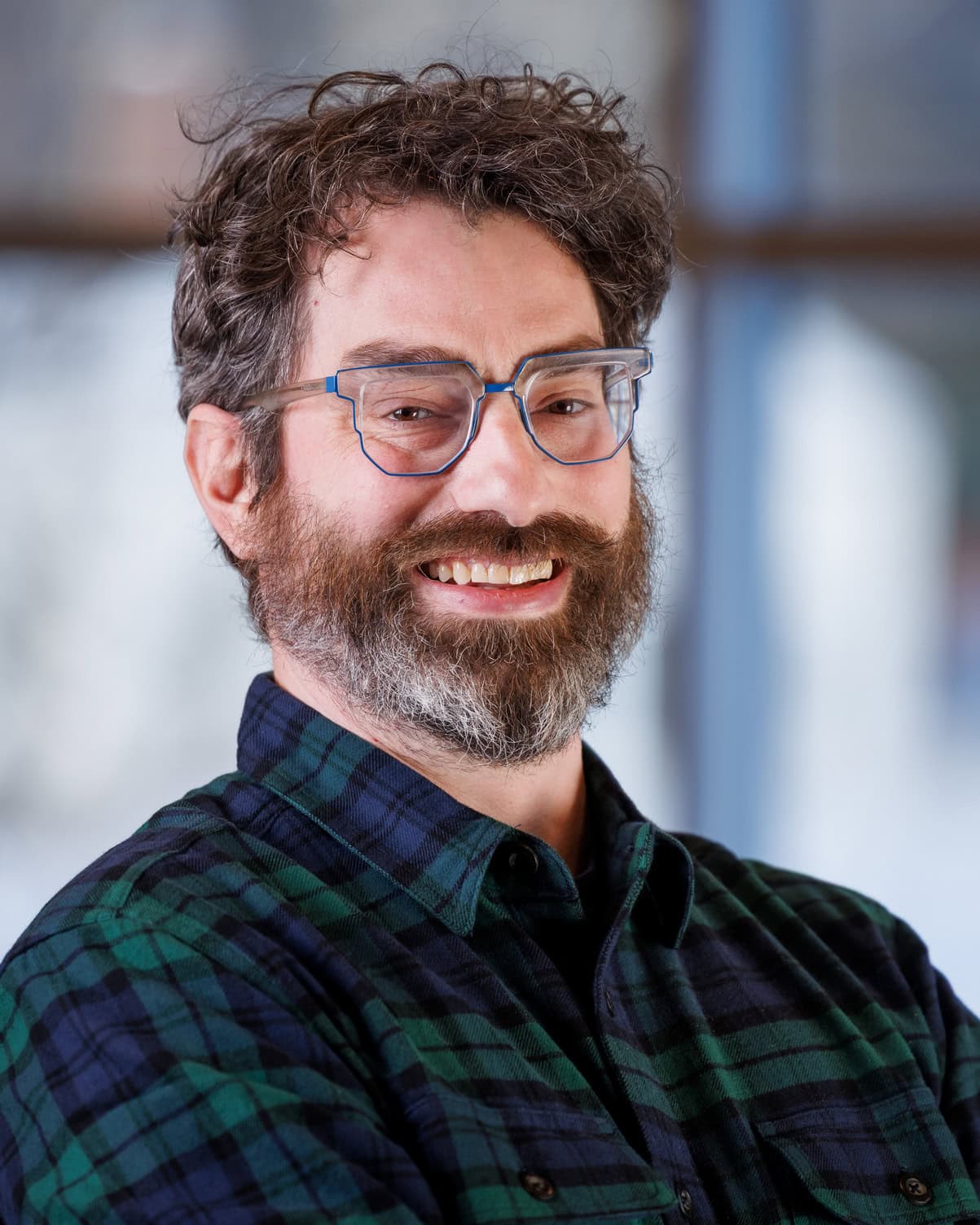 Travis Mullally smiling at the camera