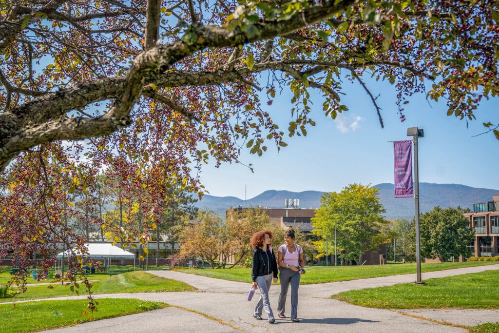Two students walk together at Vermont State University Johnson