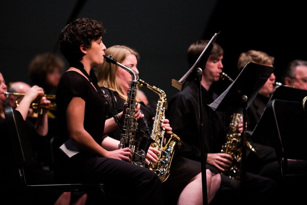 A close-up photo of the saxophone section of the Jazz ensemble  