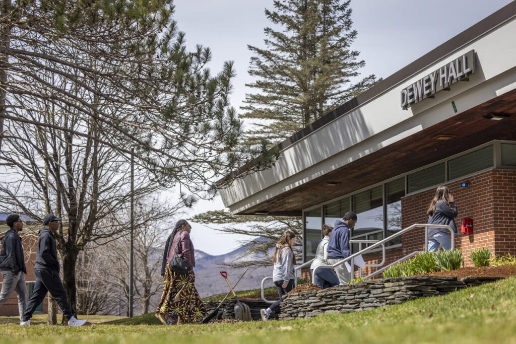 a group of students walking into Dewey Hall at VTSU Johnson