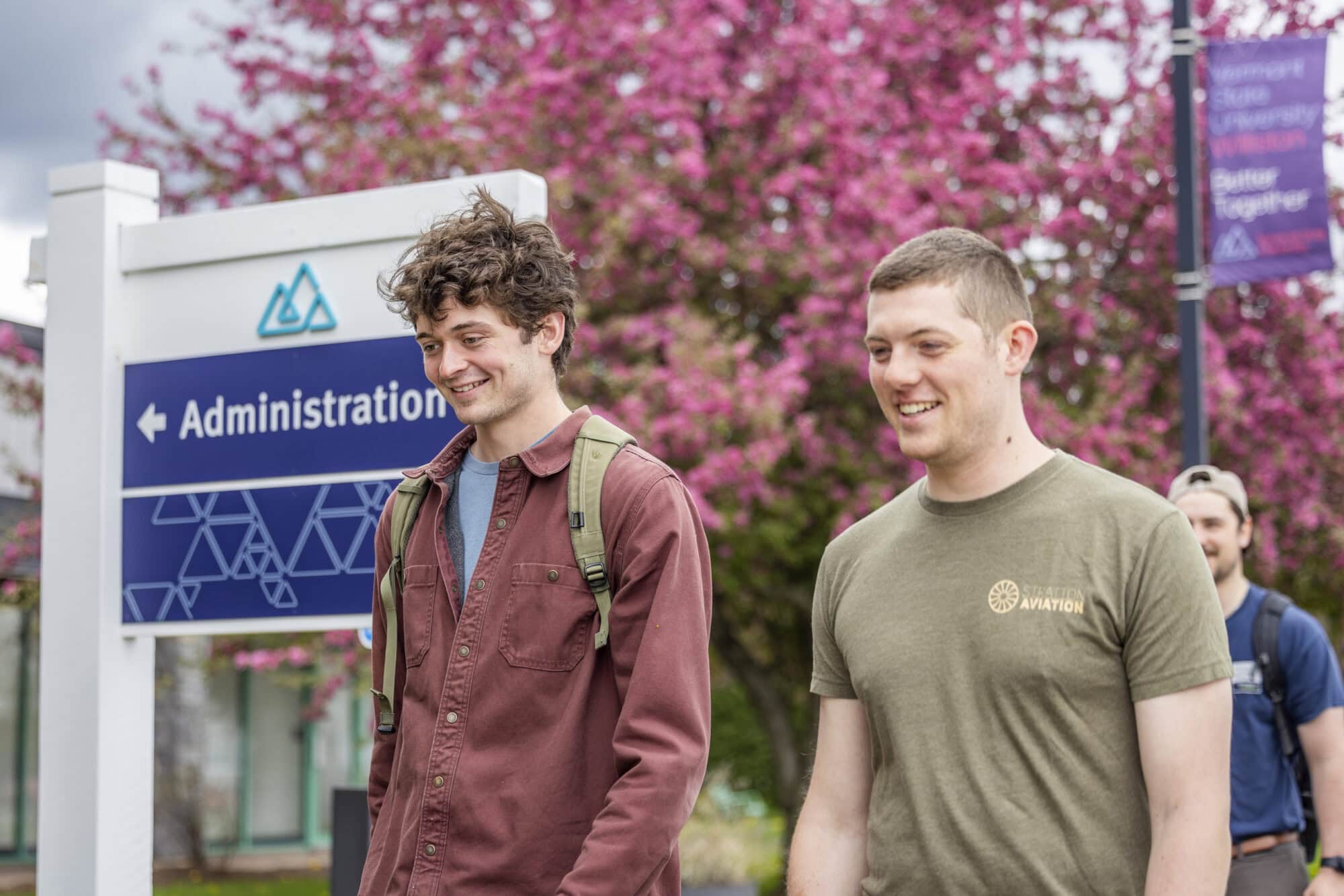 Students walk together on campus at Vermont State University Williston
