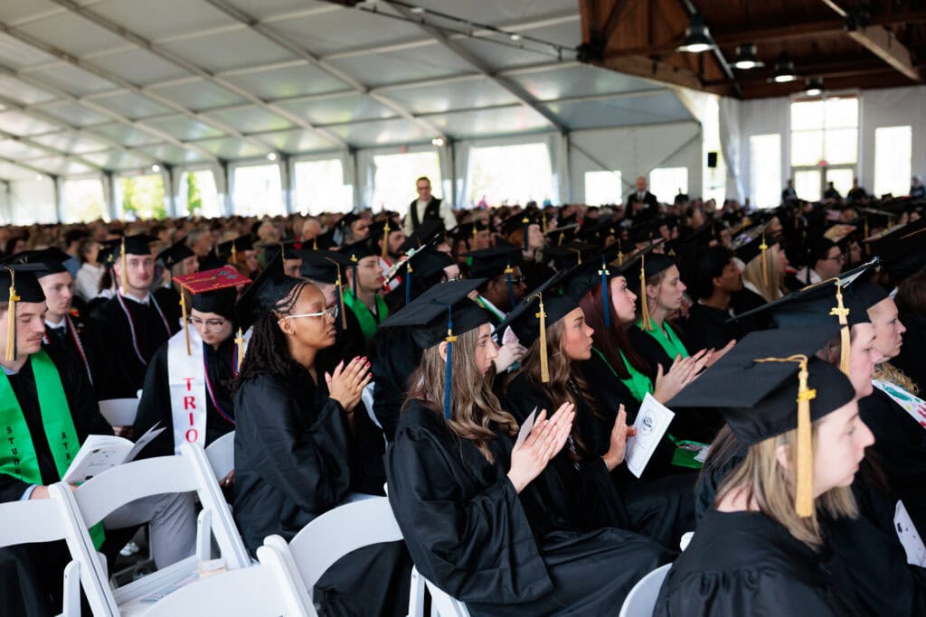 Students sitting in rows of chairs at the VTSU Castleton Commencement