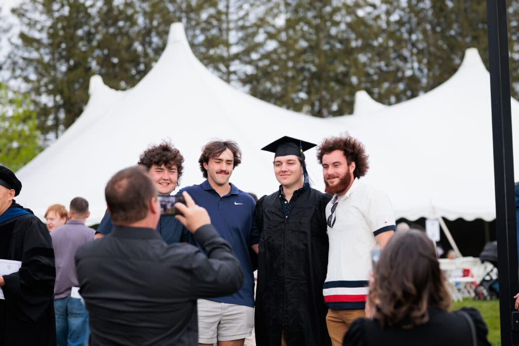 A group of men standing and posing together for a photo